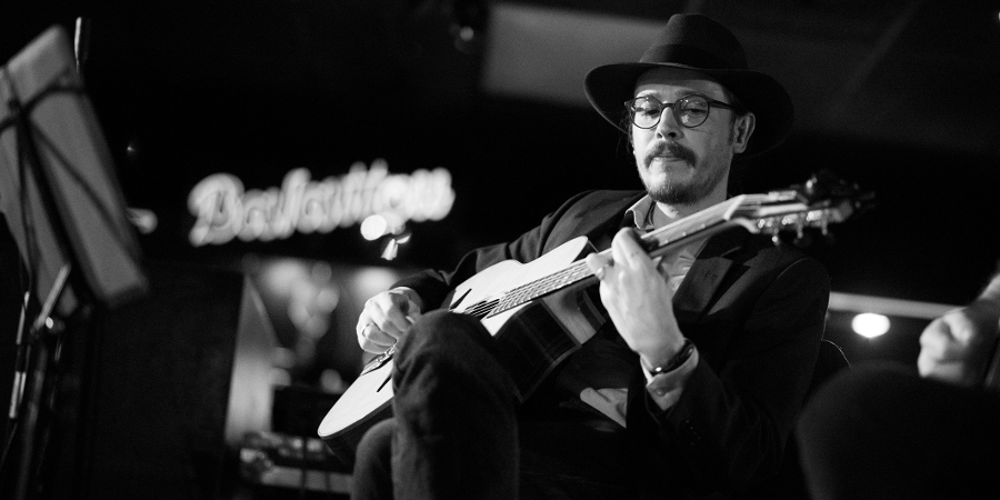 Marc Wencelius playing guitar alongside an upright bassist
