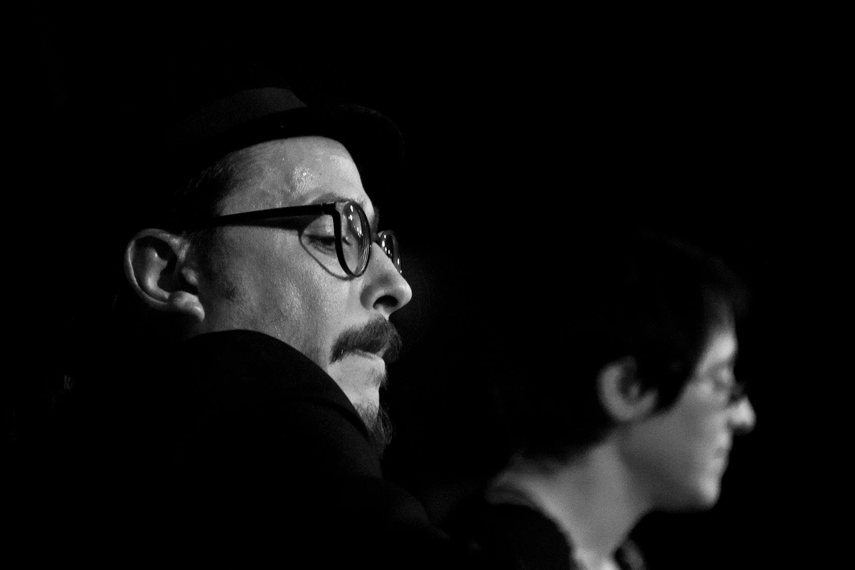 Black-and-white profile portrait of Marc Wencelius in glasses